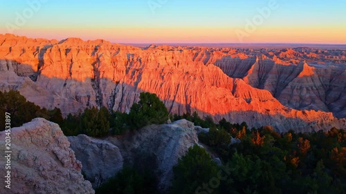 Scenic aerial view of colorful sunset over Badlands National Park from the Pinnacles viewpoint, South Dakota
