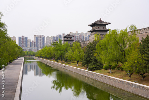 Datong city wall with traditional watchtowers and water moat in Shanxi, China