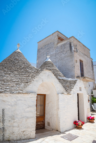 Beautiful old stone trulli houses with conical roofs in Alberobello, Puglia, Italy.