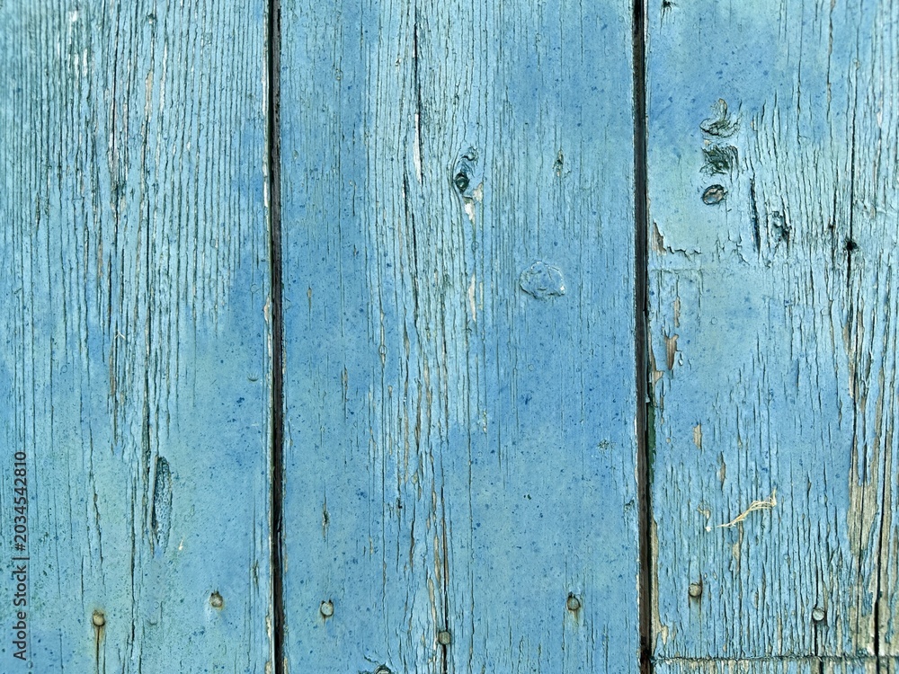 Fototapeta premium Old wooden wall with peeling paint.