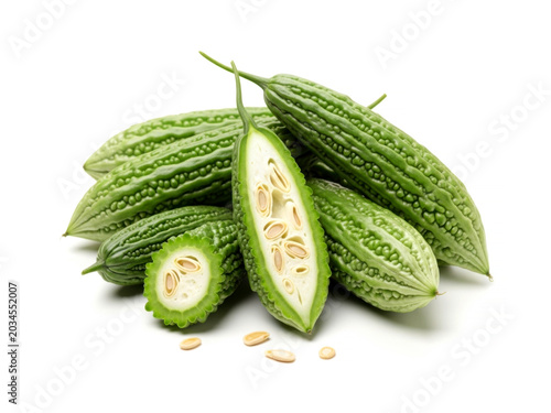 Fresh raw green bitter gourd melon vegetable isolated on white background for healthy organic Asian cooking