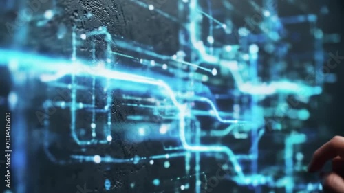 Macro video of a clean modern hand interacting with a dark gray textured surface as luminous electric blue, white, teal digital data streams react dynamically, futuristic technology concept