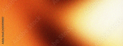 Photos Fiery orange grainy background with deep brown shadows and intense light gradient featuring film noise texture for dramatic and atmospheric art concepts