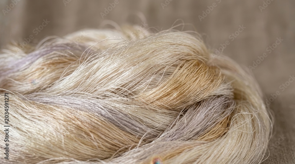 Fototapeta premium Close-up view of natural, undyed textile fibers with varying textures and colors