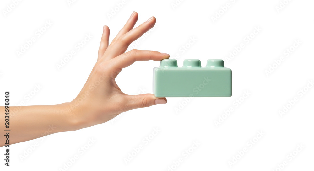 Obraz premium Hand holding mint green LEGO brick