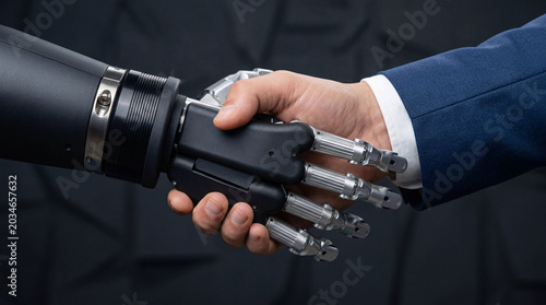 Obraz na plátně Robot handshake with human hand on dark background