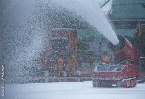 Fotografie Firefighters used firefighting robots that sprayed foam to extinguish fires during fire suppression training