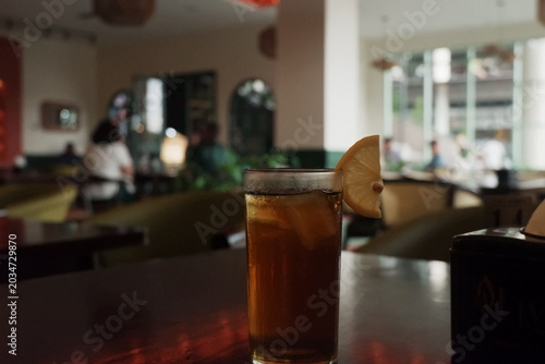 Refreshing Iced Tea with Lemon Slice on Table