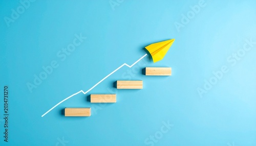 Wooden steps with upward line and paper airplane growth