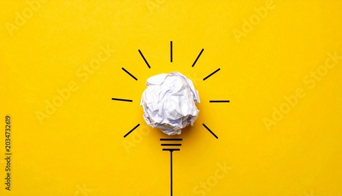 Crumpled paper forming light bulb symbolizing creativity and new ideas