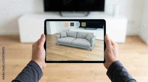 Tablet augmented reality sofa interior design real estate virtual staging, hands hold tablet showing. modern digital real estate property. home house design, cyberspace technology investment