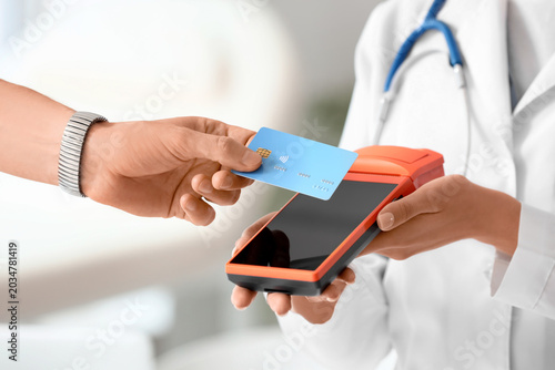 Male hand with credit card ...