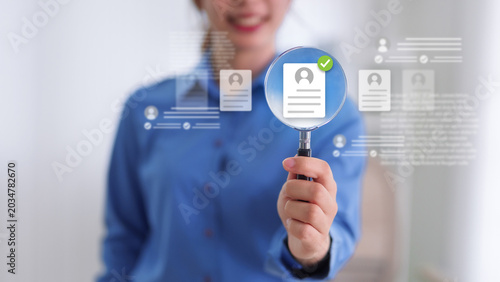 Fotografi Asian business woman holding magnifying glass candidate profile selection recrui