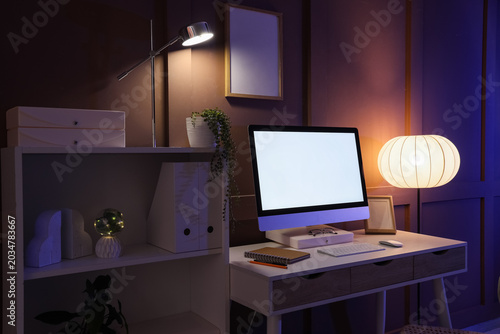 Workplace with blank comput...