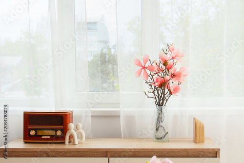 Vase with artificial magnol...