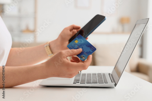 Woman with credit card and ...