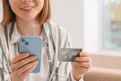 Woman with credit card usin...