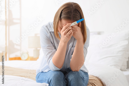 Upset woman with pregnancy ...