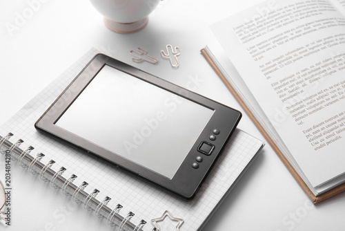 Modern e-reader with book, ...