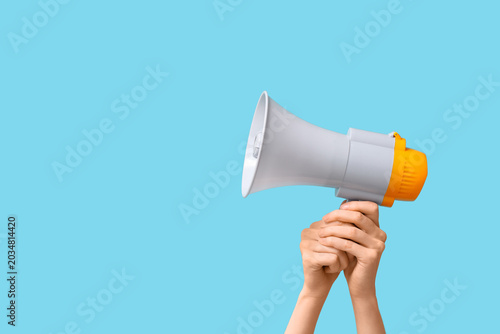 Female hands with megaphone...