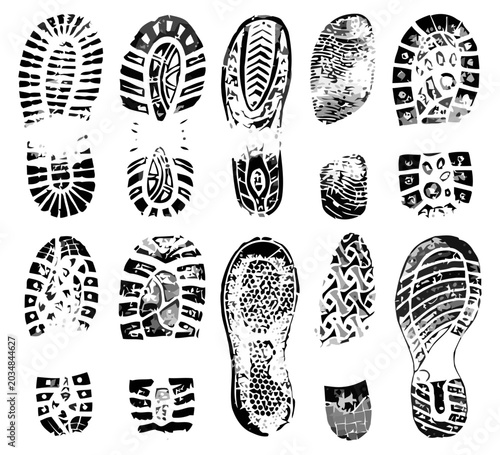 Set of diverse shoe sole prints, black ink imprints on white background