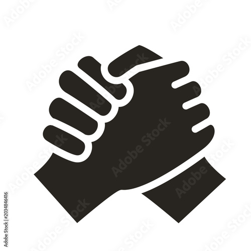 Cuadro en lienzo A black and white icon depicting two hands clasped together in a gesture of unity, friendship, or a strong handshake