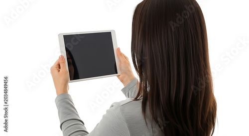 Woman holding a tablet with a blank screen in front of her face