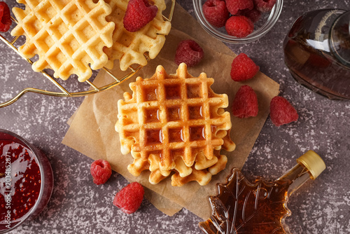 Tasty waffles with raspberr...