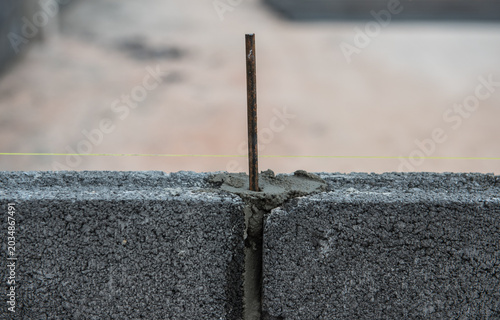 Concrete block wall surface with mortar joints for construction work.