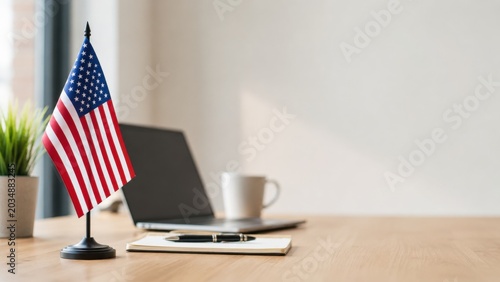 Minimalist office desk with American flag and laptop