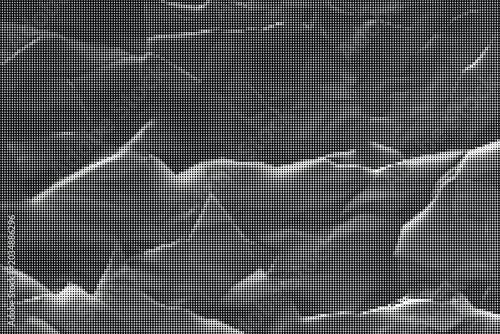 Fotografie Crinkled paper texture fills the entire frame with sharp folds and creases