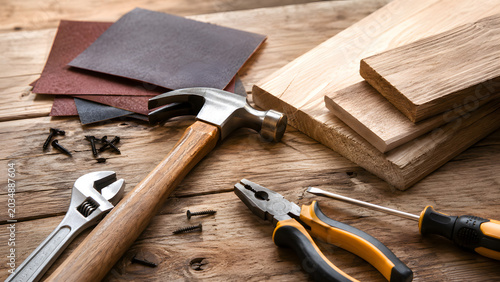 Hammer and Wood Repair Tools on Workshop Table