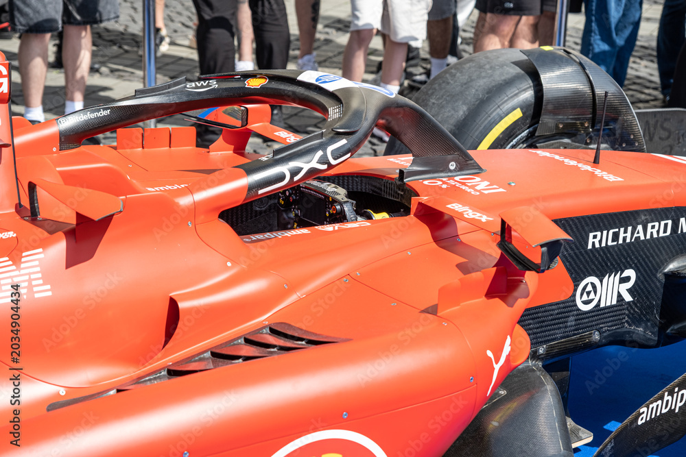 Naklejka premium Sibiu, Romania - May 25, 2026 a Ferrari SF-26 Formula 1 car unveiled for the 2026 exhibited in the large square in the city center Sibiu
