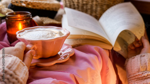 Bilde på lerret Cozy morning with coffee, book, and candle light for relaxation