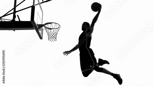 Cuadro en lienzo Basketball player silhouette dunking against a white background a dynamic sports