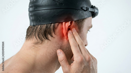 Swimmer's Ear Pain: Male Athlete Experiencing Earache After Water Sports, Otitis Externa, Health Issue Concept
