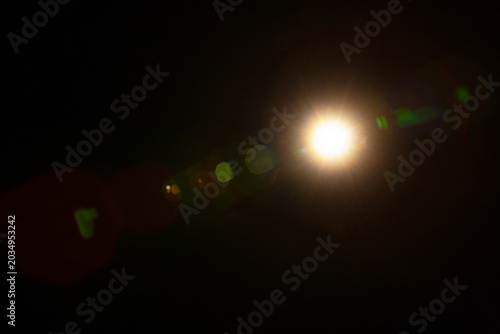 Sun flare on the black background