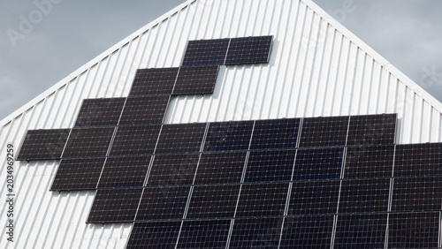 Geometric solar panel layout on slanted roof