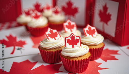 Festive Canada Day cupcakes decorated with maple leaves, celebratory dessert