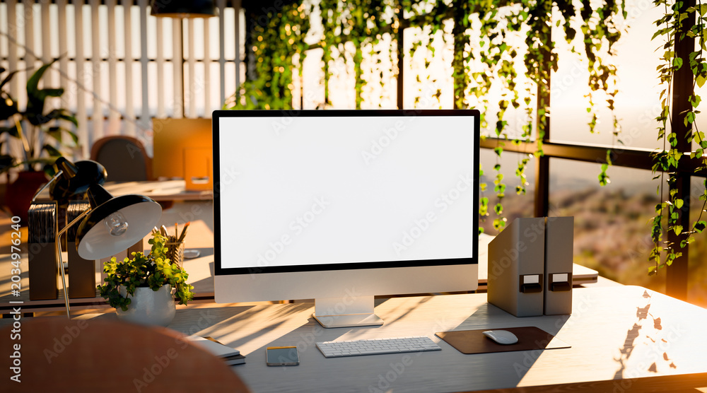 Obraz premium Modern Office Workspace with Computer Blank Screen and Sunlight
