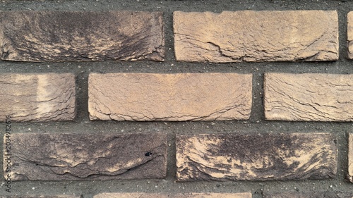 Quadro su tela Macro clinker brick wall texture background, beige and ochre clay brickwork clos