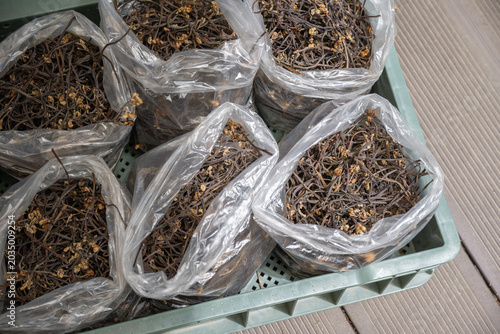Fotografie Packaged dried bracken fern for commercial food market supply