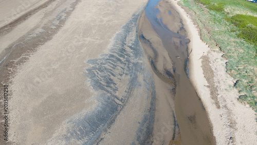 Aerial view of a wide sandy beach at low tide Ayrshire Scotland