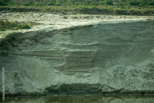 A dramatic closeup of an eroded riverbank reveals beautiful