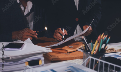 Obraz na płótnie Professional photo of a person's hands reviewing a contract or legal document on