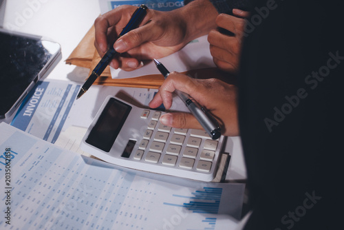 Konstfotografi Professional photo of a person's hands reviewing a contract or legal document on