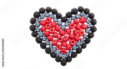 Heart shape made of berries raspberries blueberries and blackberries as isolated element