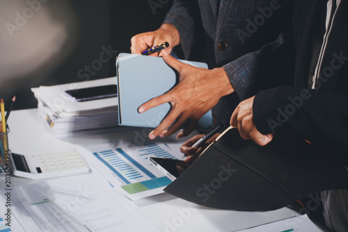 Tableau sur toile Professional photo of a person's hands reviewing a contract or legal document on