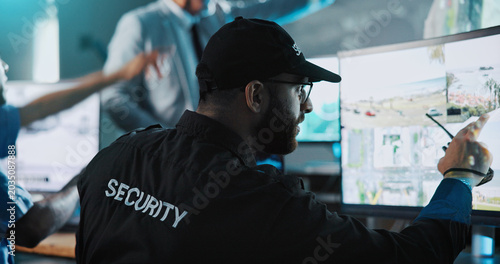 Obraz na plátně Man, security officer or pointing with surveillance for crime detection or safety in control room