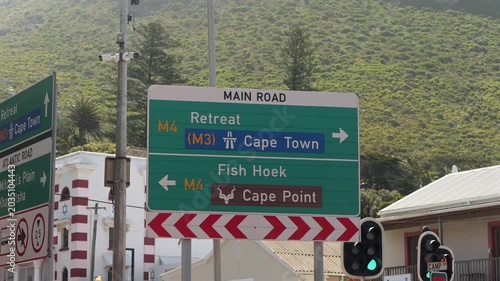 Traffic sign pointing directions to Cape Town, Fish Hoek and Cape Point in Muizenberg, South Africa. 